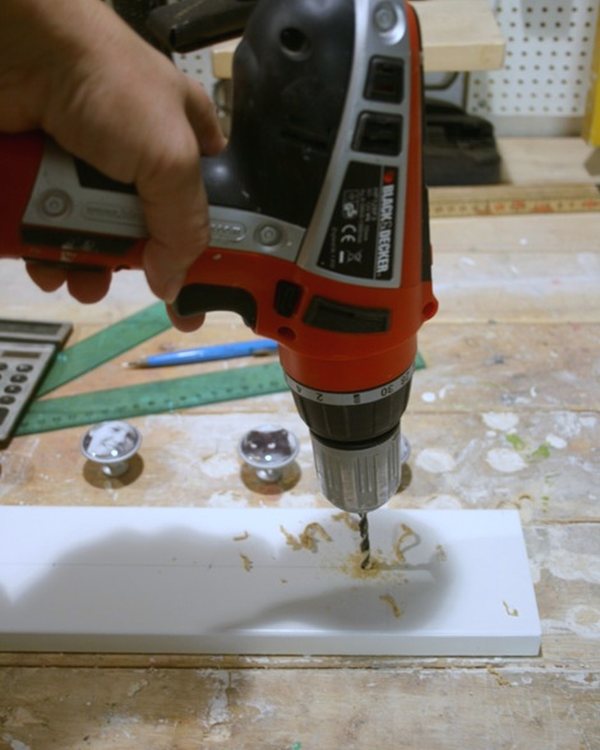 The board face down on the bench with a hanging plate outline scored into it