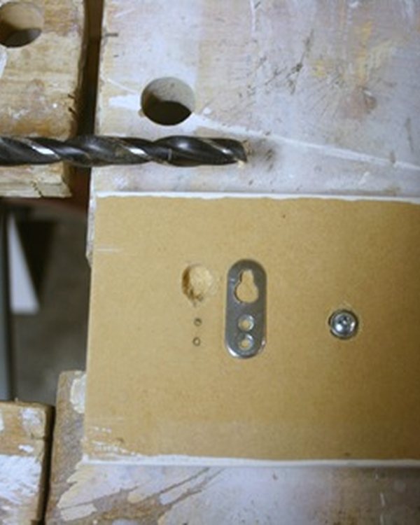 Paring out the recess for a hanging plate with a knife blade