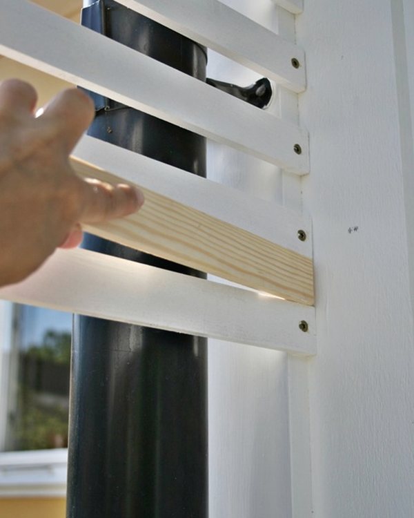 Fitting a horizontal slat to the upright, using an offcut as the spacer