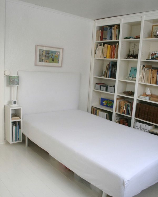 The bed stripped back to the base and overlay mattress