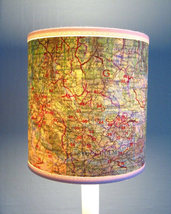 The lamp shade covered in a road map, lit from within