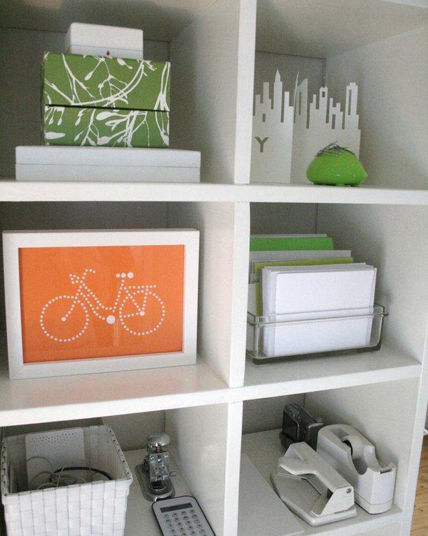 Cubbies holding files, trays and a green ceramic pig