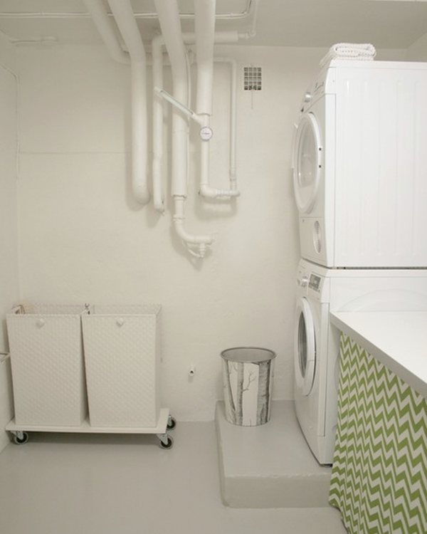 The laundry room with the worktop and green chevron curtain under it