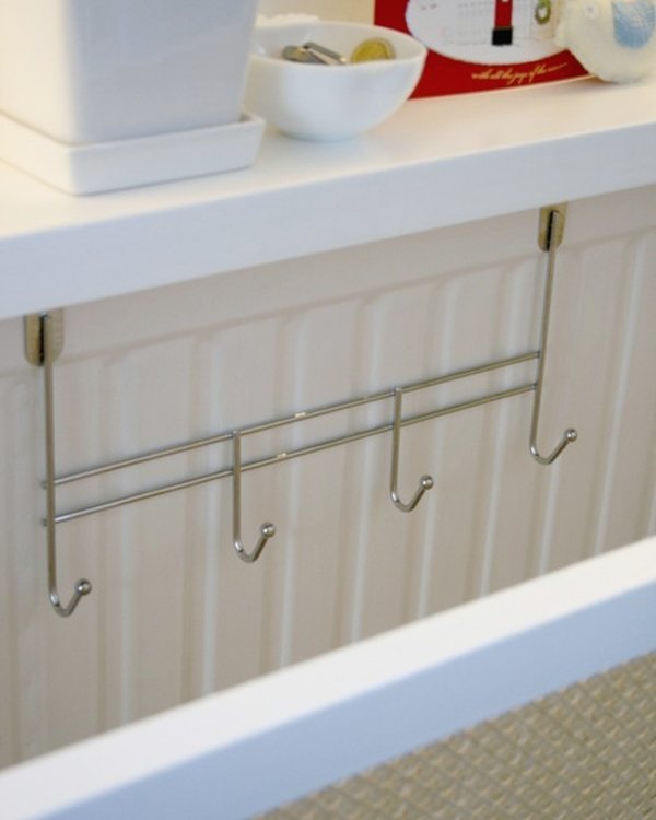 The finished radiator cover with caned front, hooks underneath