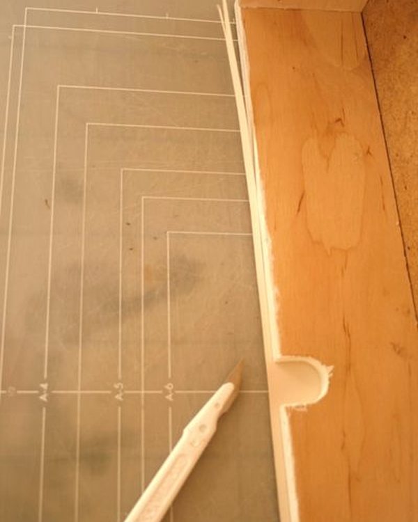 Marking the drawer front against the back of the wallpaper